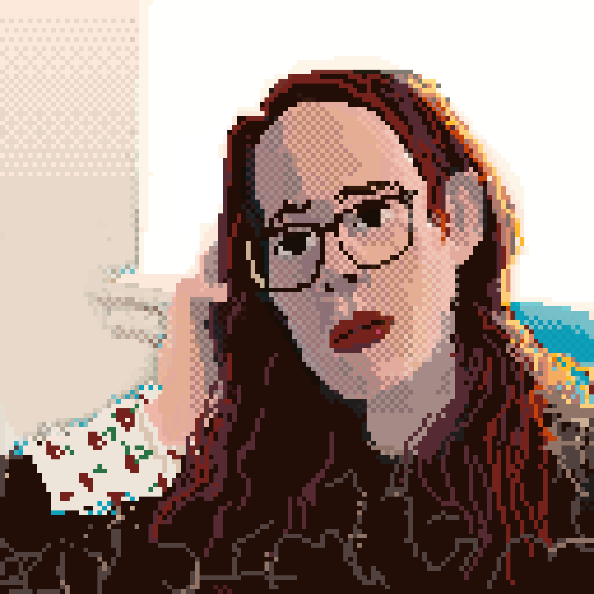 portrait of a person with red hair and glasses wearing a black sweater and an undershirt with a cherry pattern.