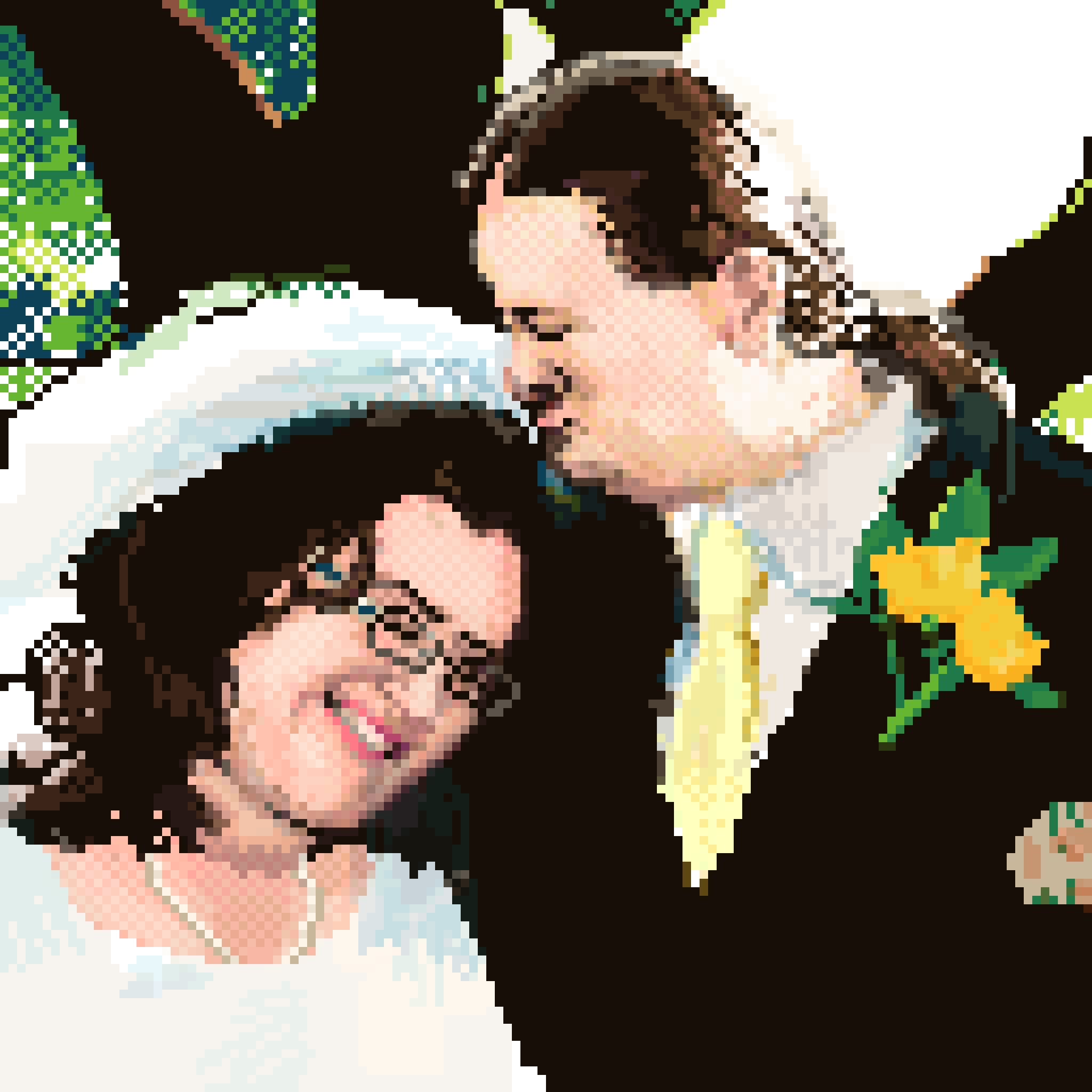 portrait of a newlywed couple, one wearing a white gown and smiling and the other wearing a black tuxedo and kissing the other's head.